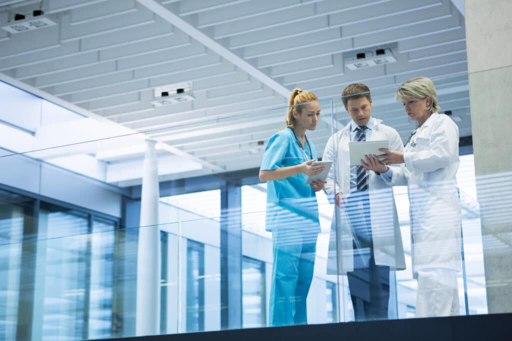 Hospital staff reviewing compliance training to ensure adherence to medical regulations.