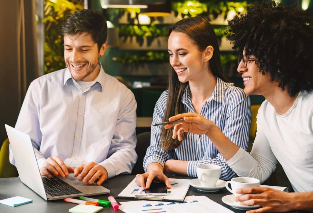 Team members collaborating during a leadership training session in a modern workplace setting