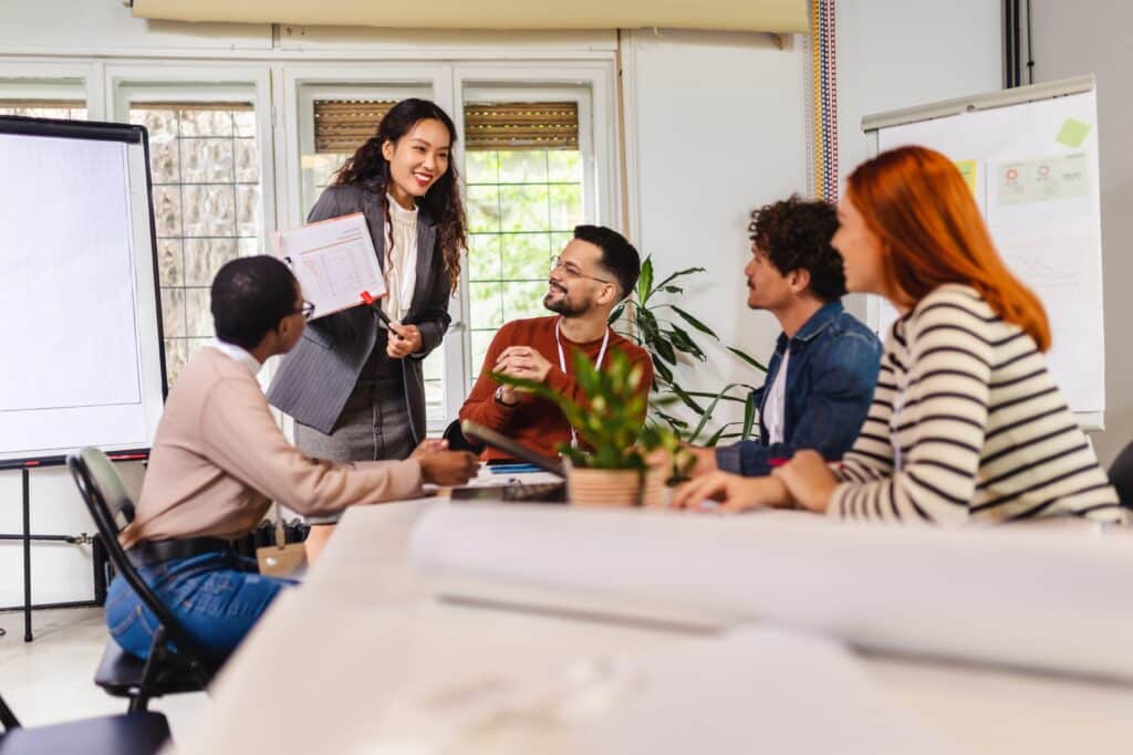 Team leader presenting employee growth and development progress during a workplace mentoring session