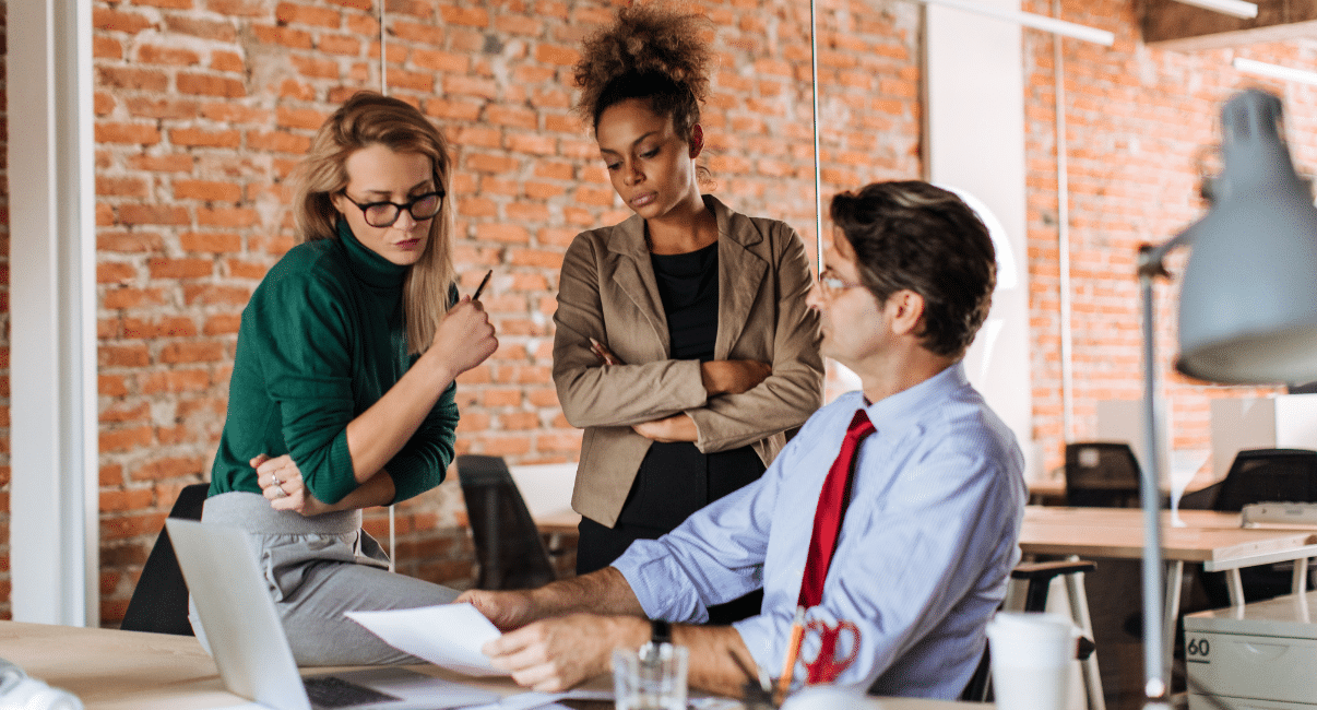 Workplace leaders in a serious discussion about psychosocial risk management compliance in Australia